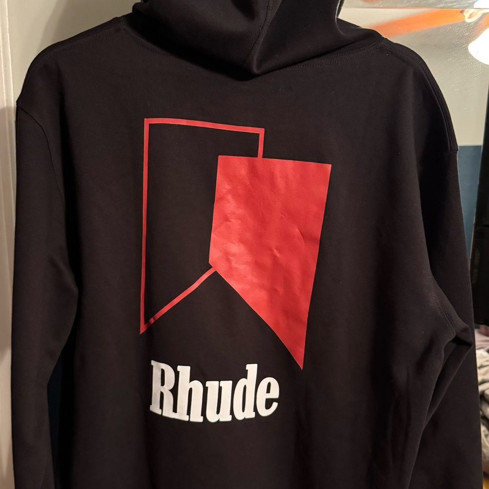 Rhude brand hooded sweatshirt NWOT
Black with red and white design